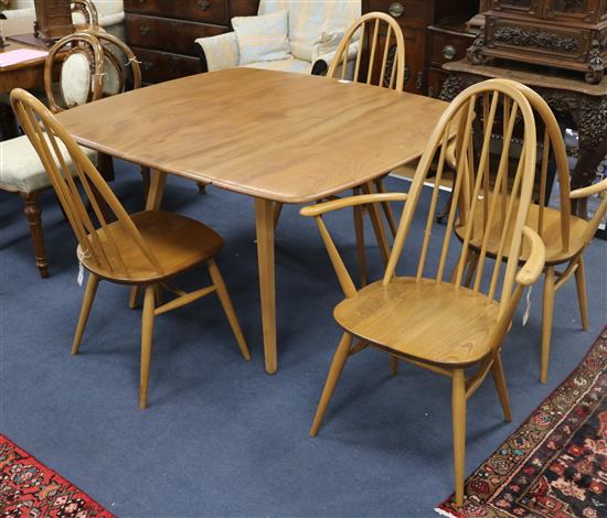 An Ercol drop leaf dining table and four chairs c.1967, Extended W.125cm